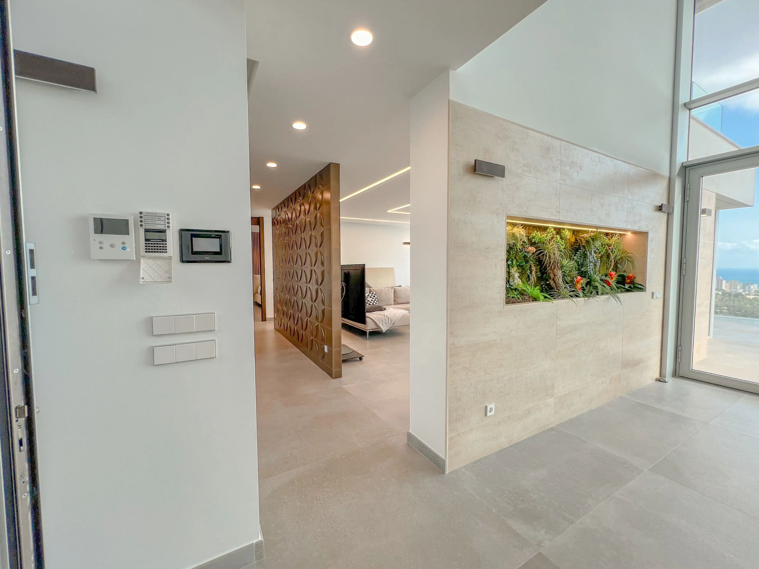 Luxury Modern Villa For Sale In Calpe with Panoramic Sea and Mountain Views. - living area with large windows