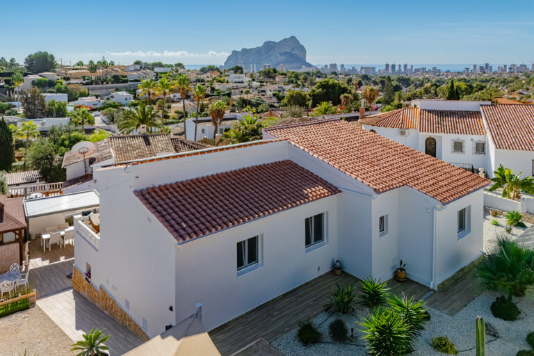 Aerial view of residential area in Calpe with sea and Peñón de Ifach