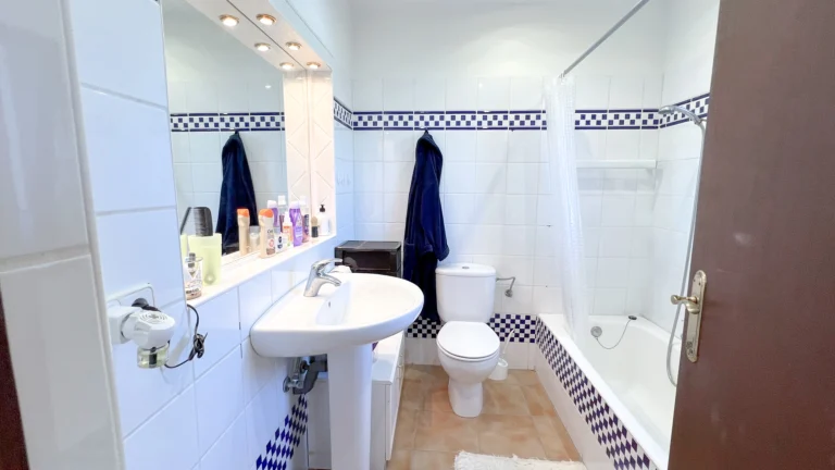 Bathroom with bathtub and tiled walls in Benissa country property