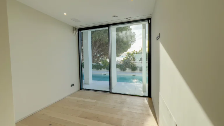 Bright bedroom with terrace access and garden views in Altea villa