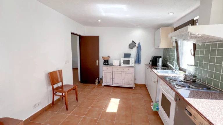 Bright kitchen with tiled floor and countryside style in Benissa finca
