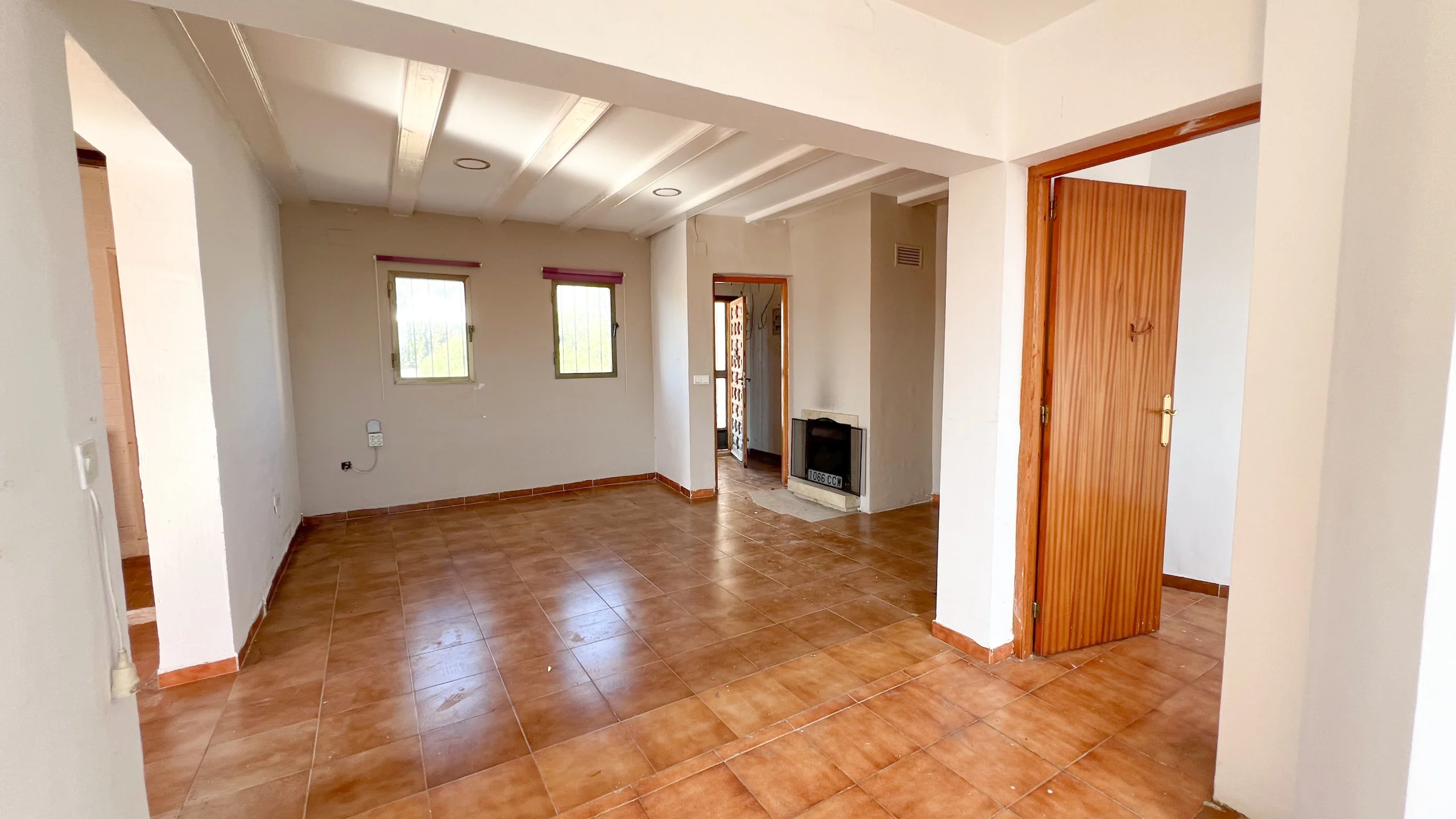 Bright living area with tiled flooring and renovation potential in Calpe home