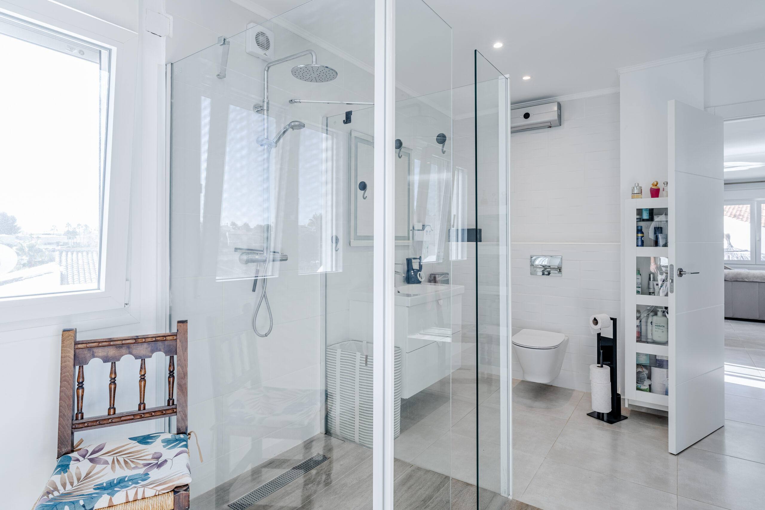 Contemporary bathroom with double shower and glass enclosure in a Mediterranean villa