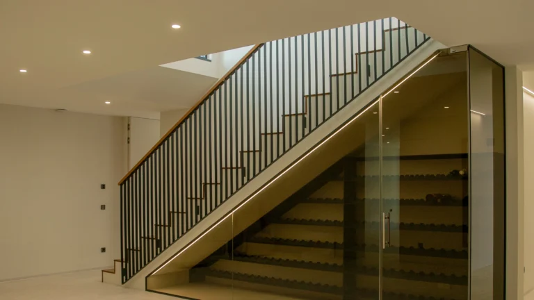 Contemporary staircase with glass railing in luxury first-line villa Altea