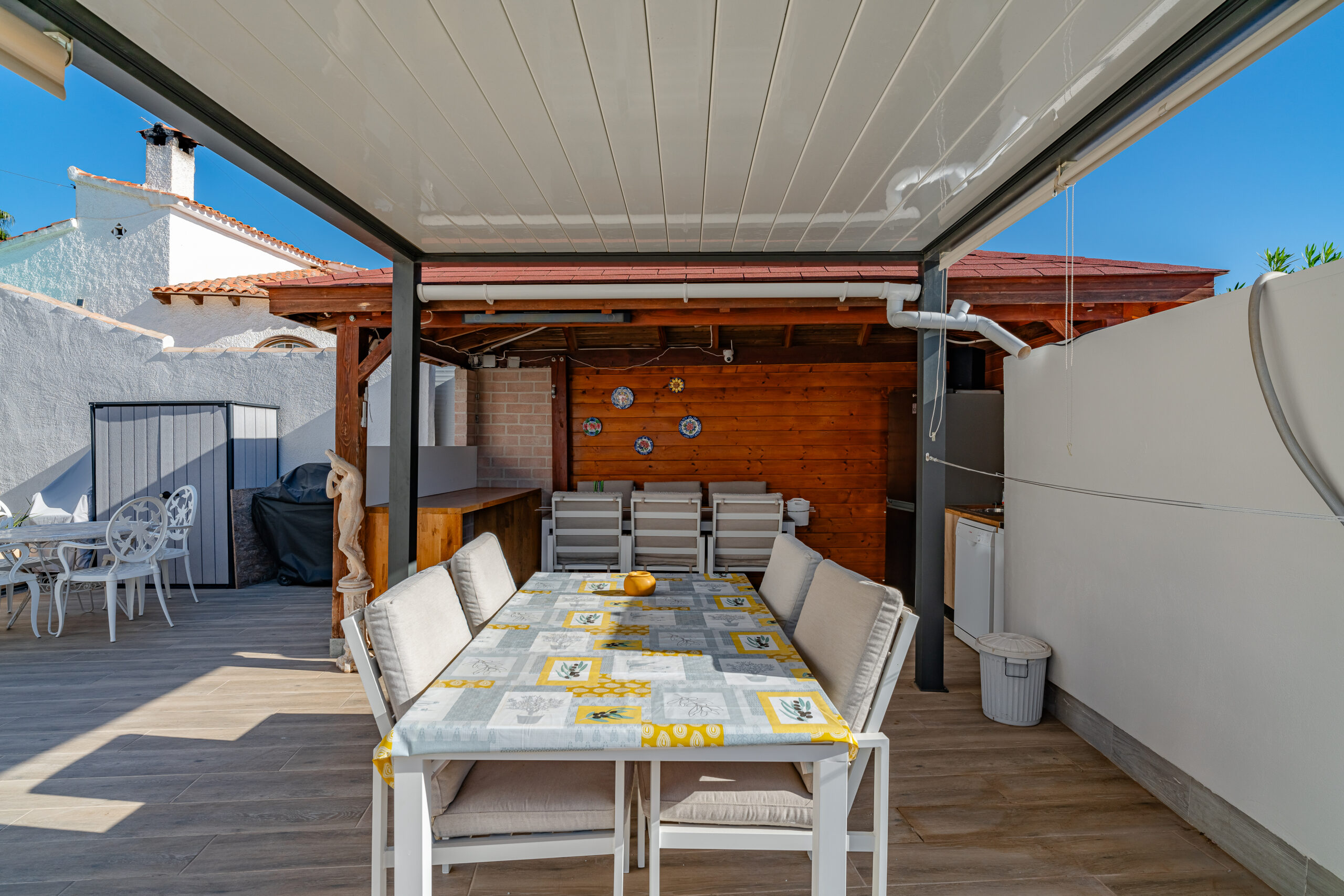 Covered outdoor dining terrace in a Mediterranean villa in Calpe