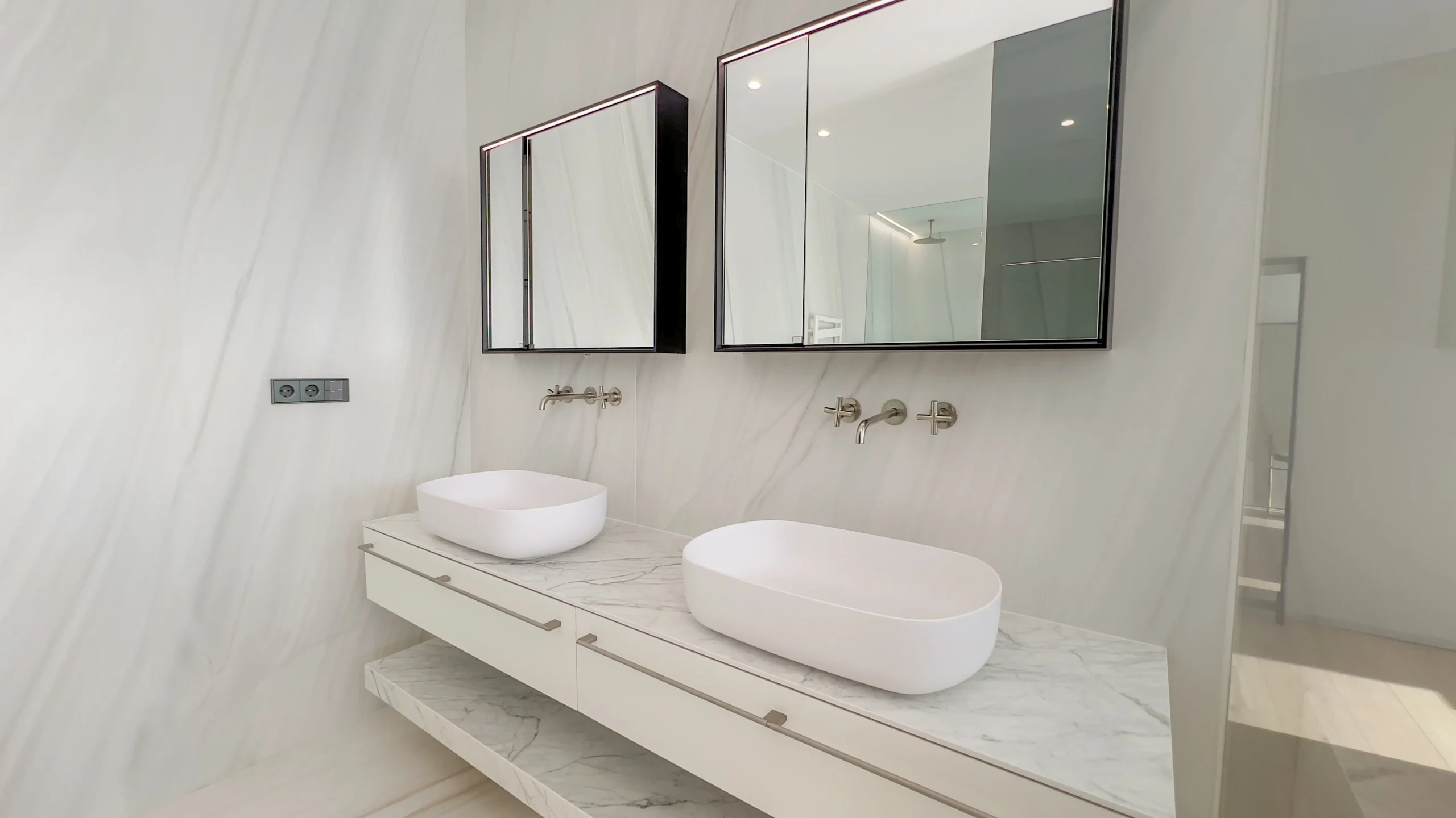 Double vanity designer bathroom with marble finishes in first-line villa Altea