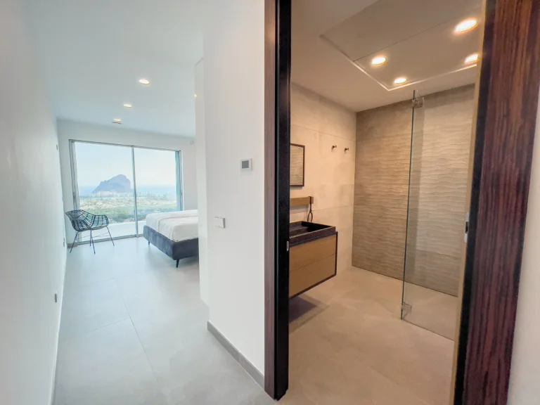 En-suite bedroom entrance with sea-view window and walk-in shower