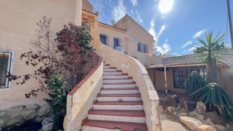 Exterior staircase leading to main entrance of renovation villa in Calpe