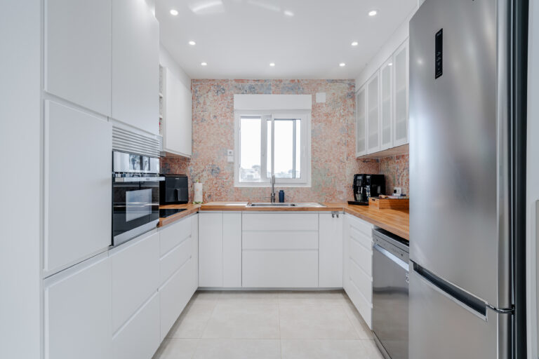 Fully equipped modern white kitchen with built-in appliances in a Calpe villa