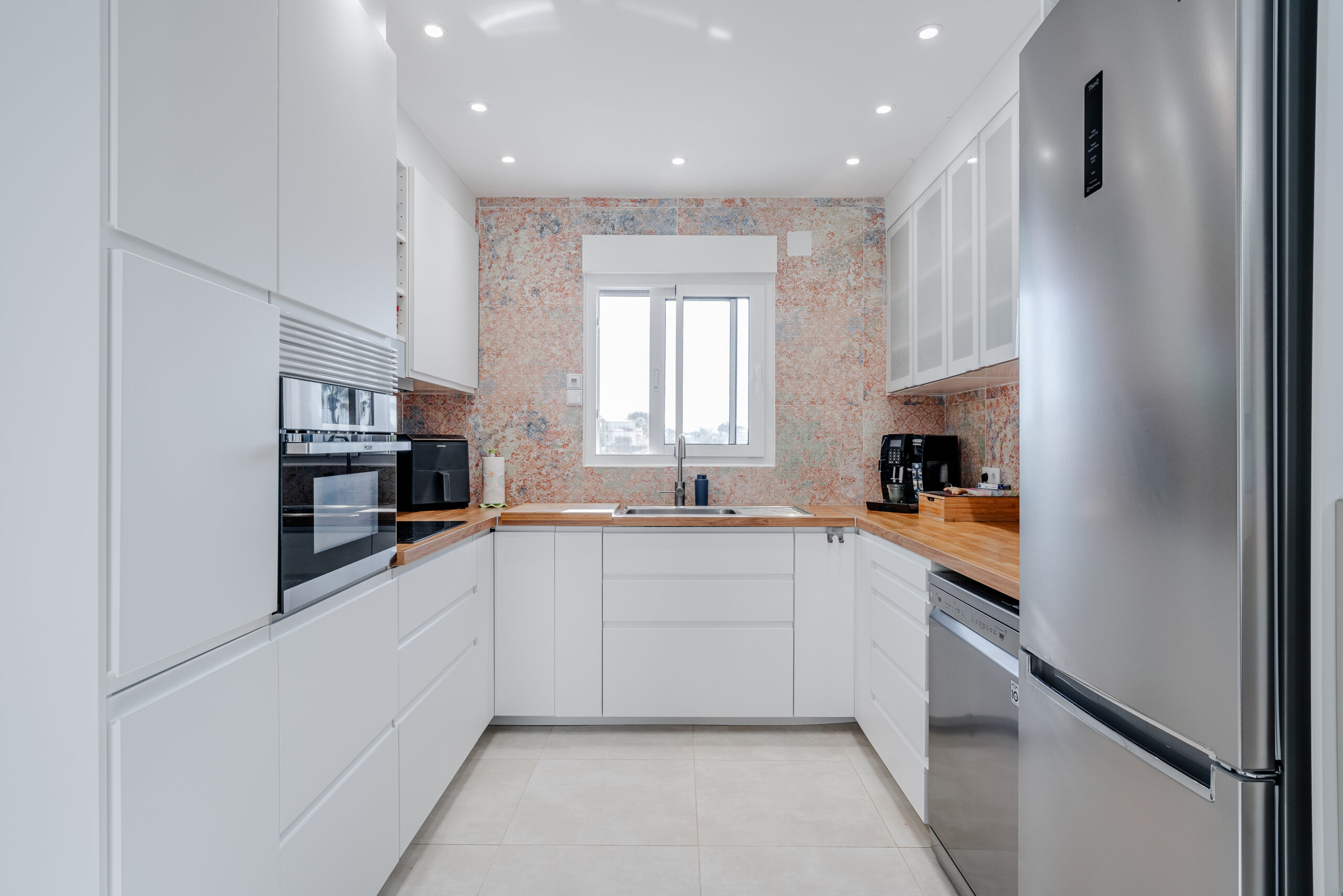 Fully equipped modern white kitchen with built-in appliances in a Calpe villa