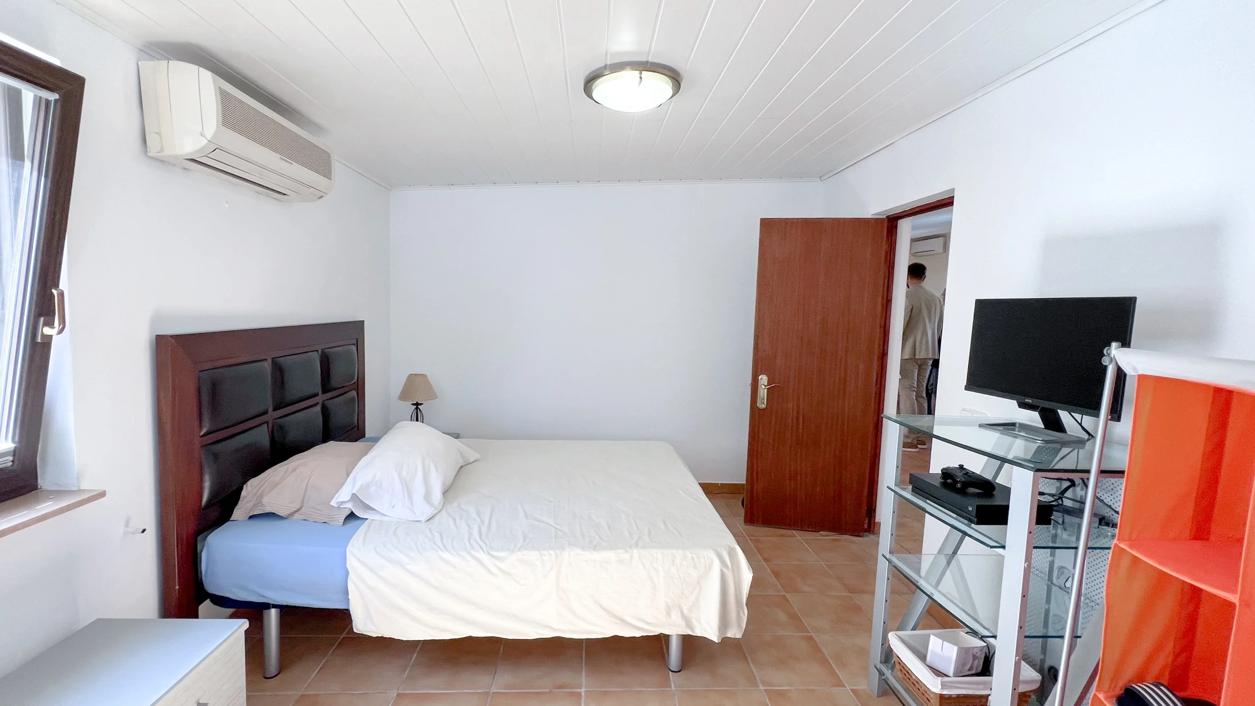 Guest bedroom with double bed and TV in Benissa country property