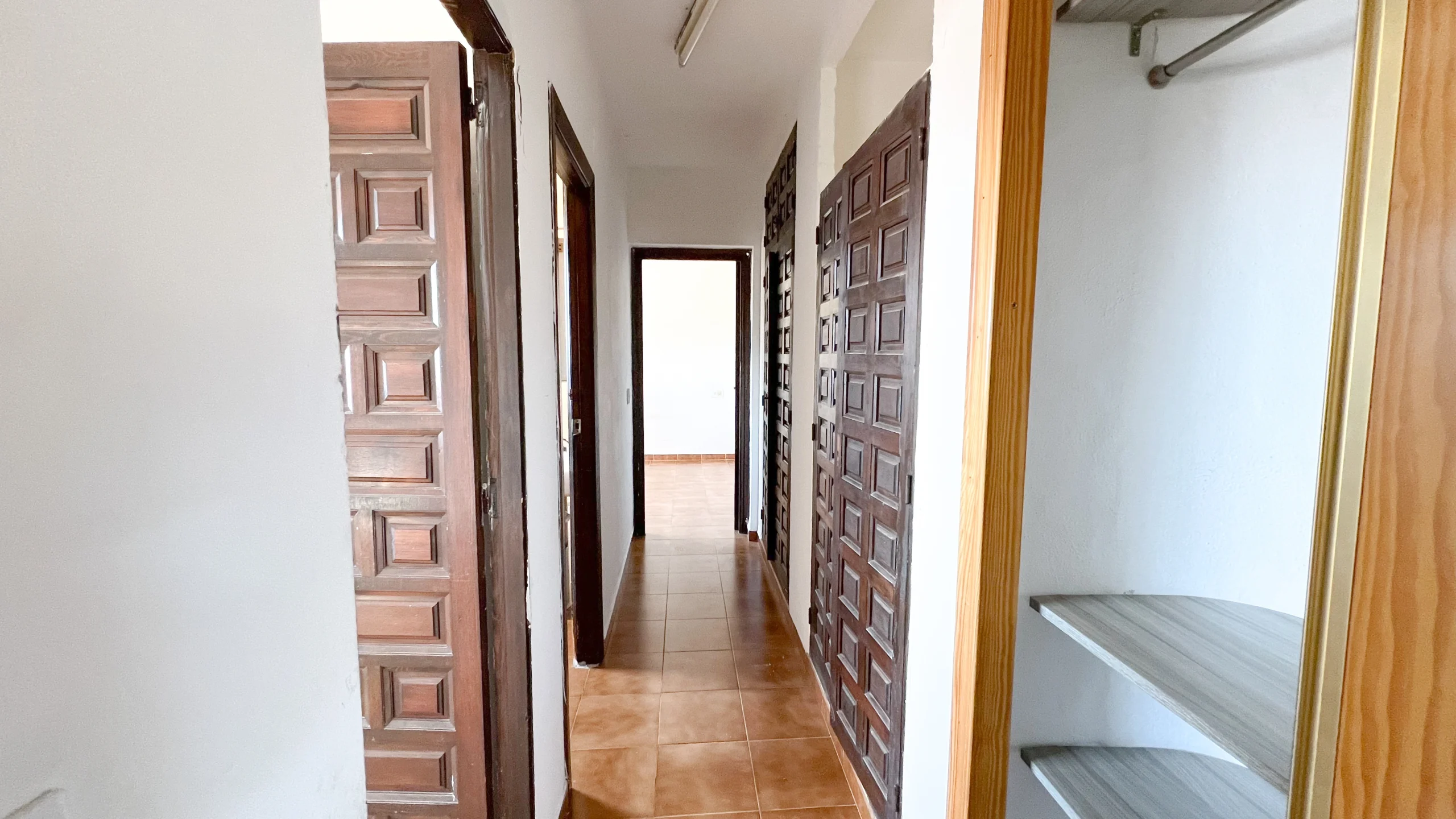 Hallway with wooden doors in Calpe renovation villa