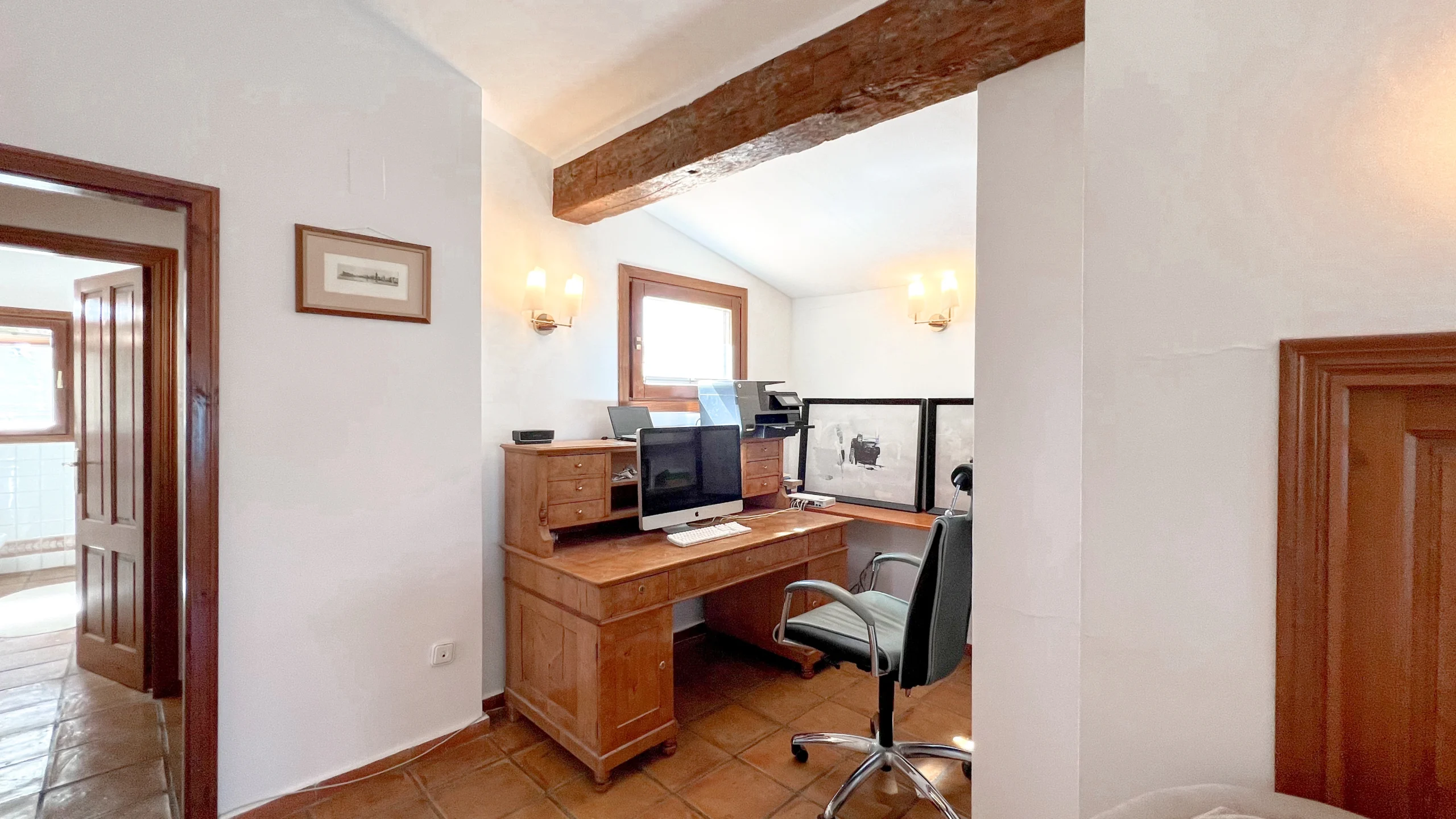 Home office with desk and wooden beams in Benissa rural property