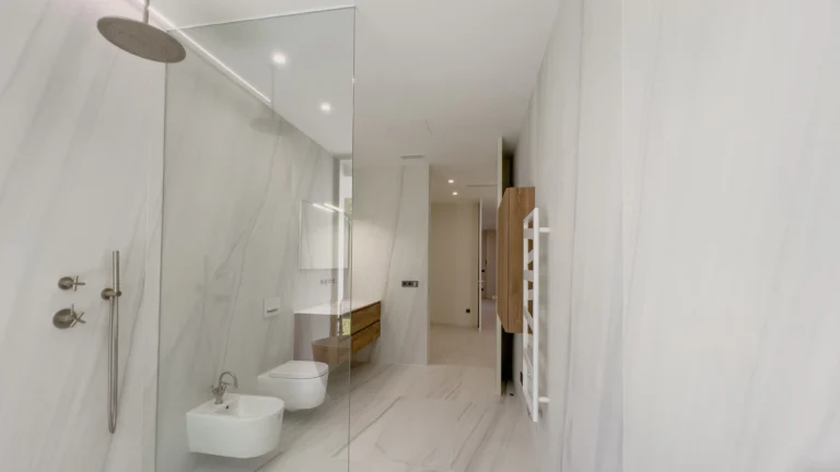 Large marble bathroom with walk-in shower and double sinks in Altea villa