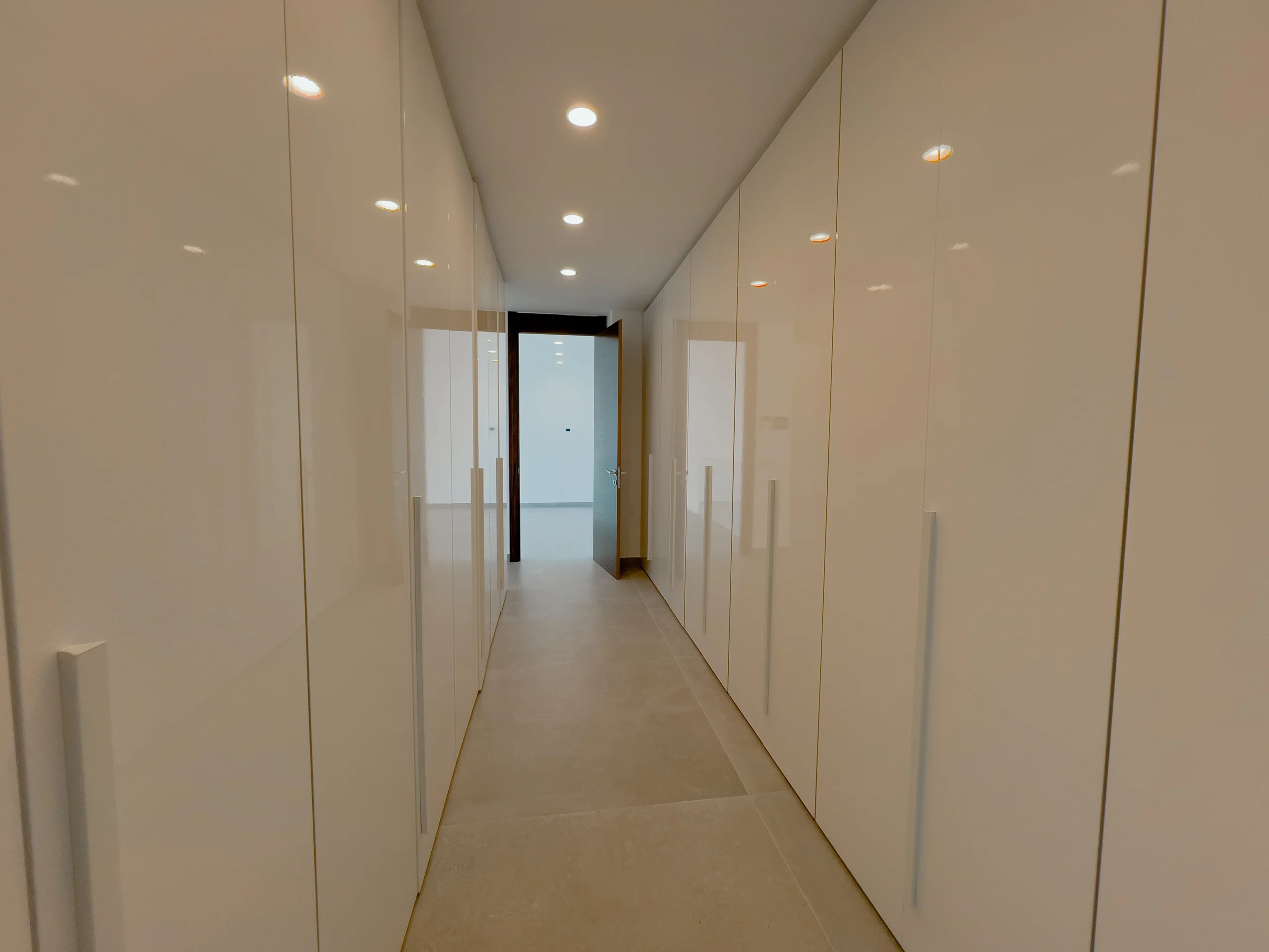 Long hallway with built-in wardrobes leading to the master suite in a luxury Calpe villa