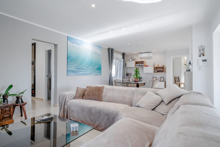 Open-plan living space with panoramic windows in a Calpe sea-view villa