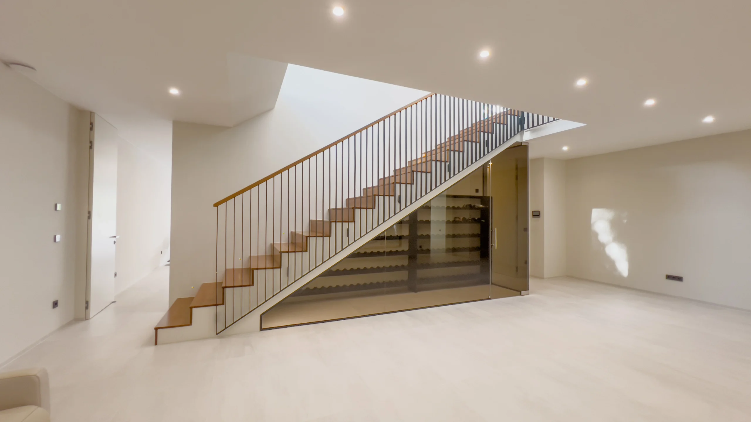 Open-plan lower floor with staircase and natural lighting in Altea luxury villa