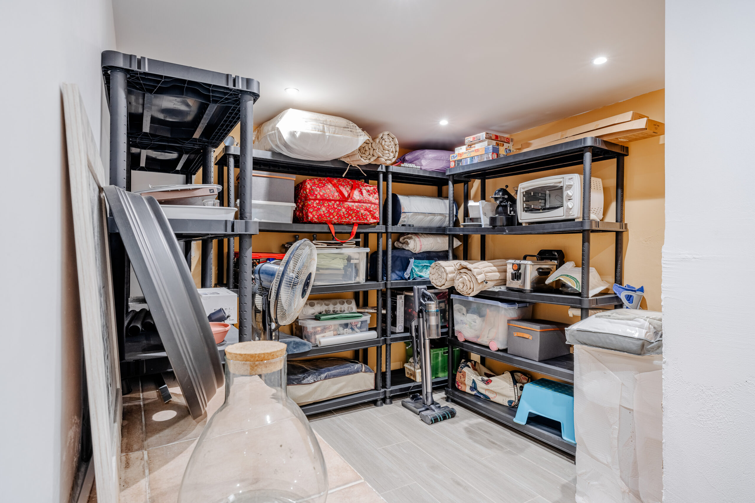 Organized storage room with shelving units in a renovated villa in Calpe