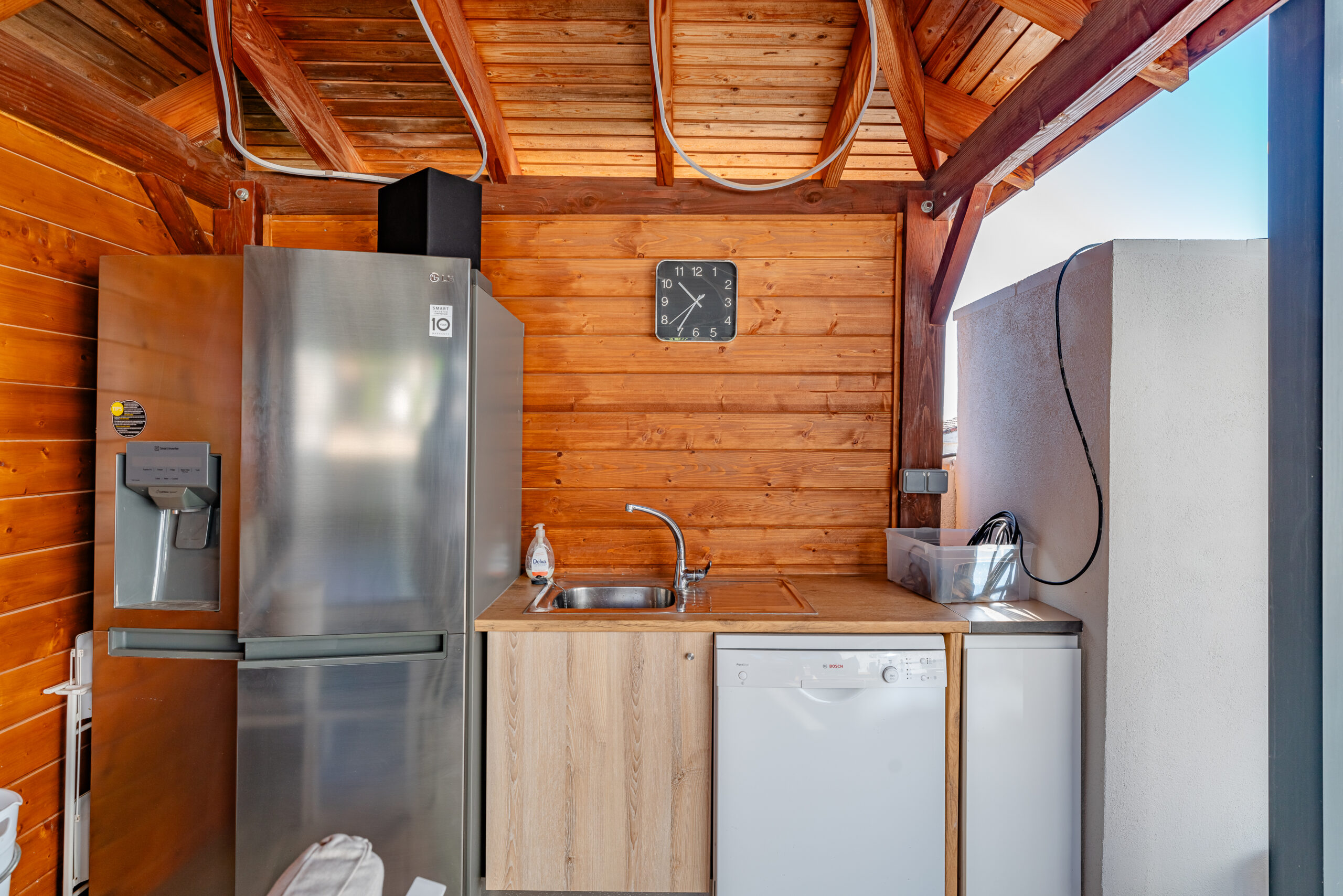 Outdoor summer kitchen with fridge and sink in a Calpe villa