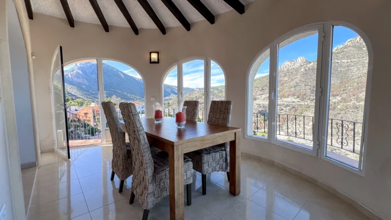 Sea-view dining area with beam ceiling at Maryvilla Calpe villa