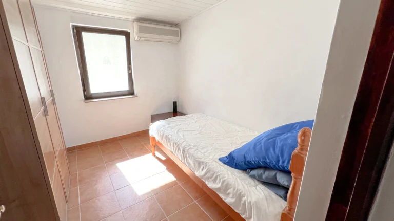 Single bedroom with wardrobe and tiled floor in Benissa villa