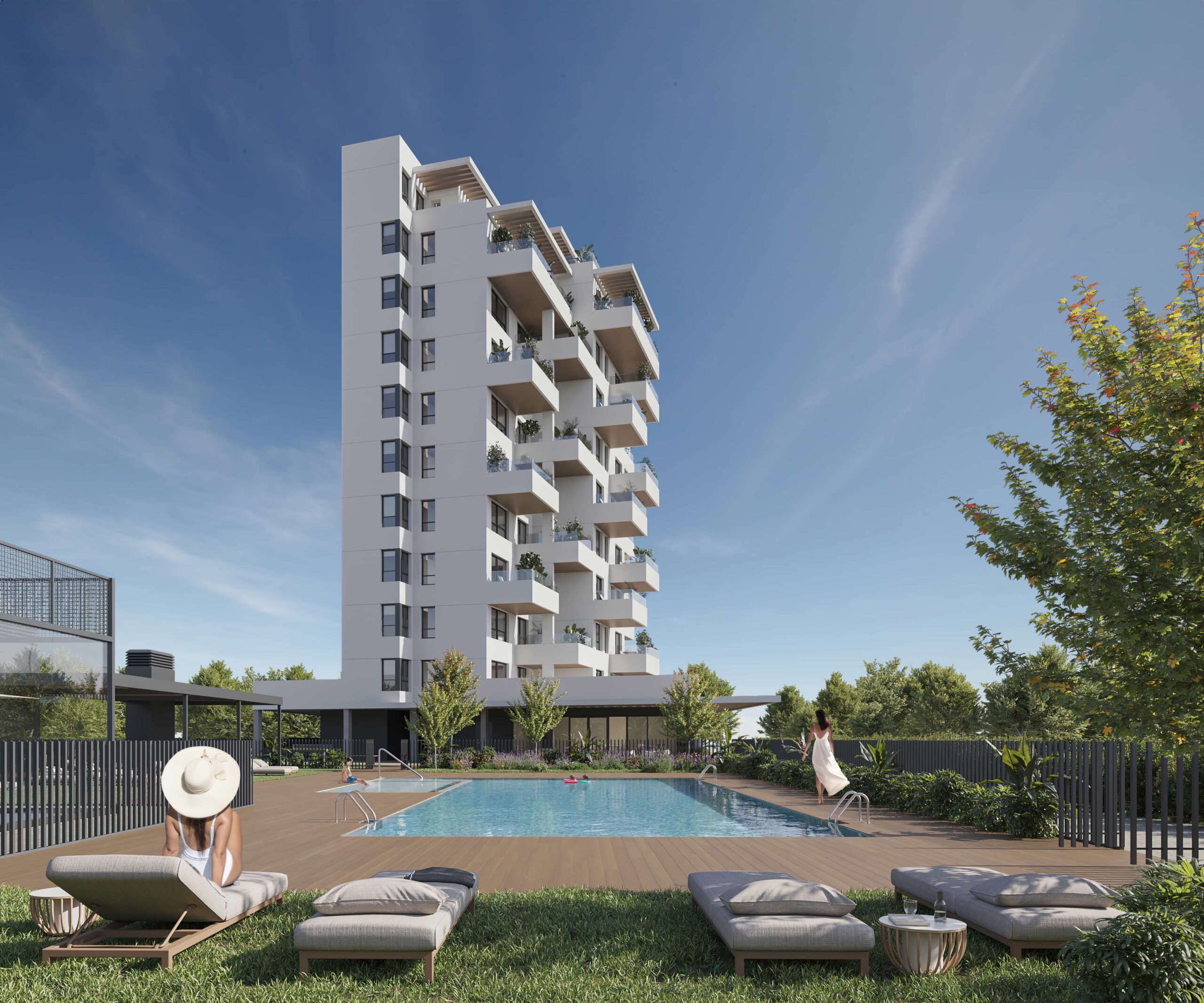 Swimming pool and garden area facing modern residential buildings in new development, Calpe