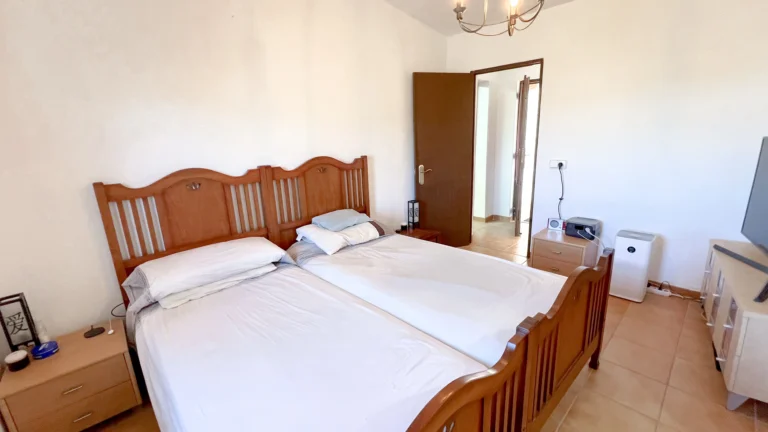 Traditional double bedroom with wooden bed frame in Benissa villa