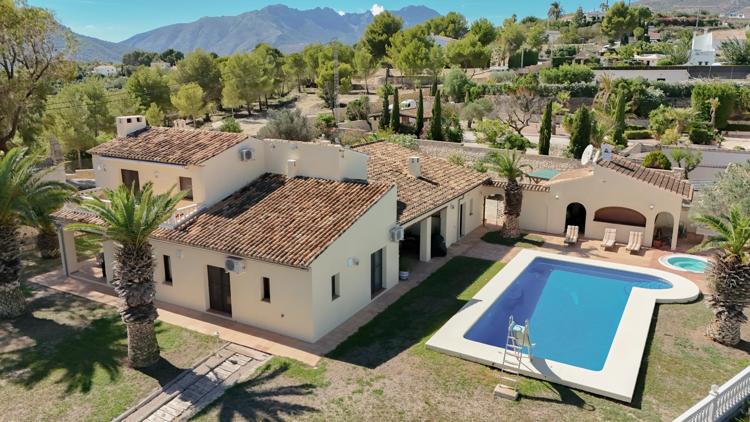 Traditional finca exterior with pool and palm trees in Benissa countryside