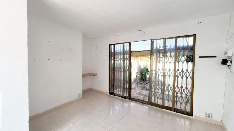 Unfinished living room with sliding doors and garden access in Calpe renovation villa