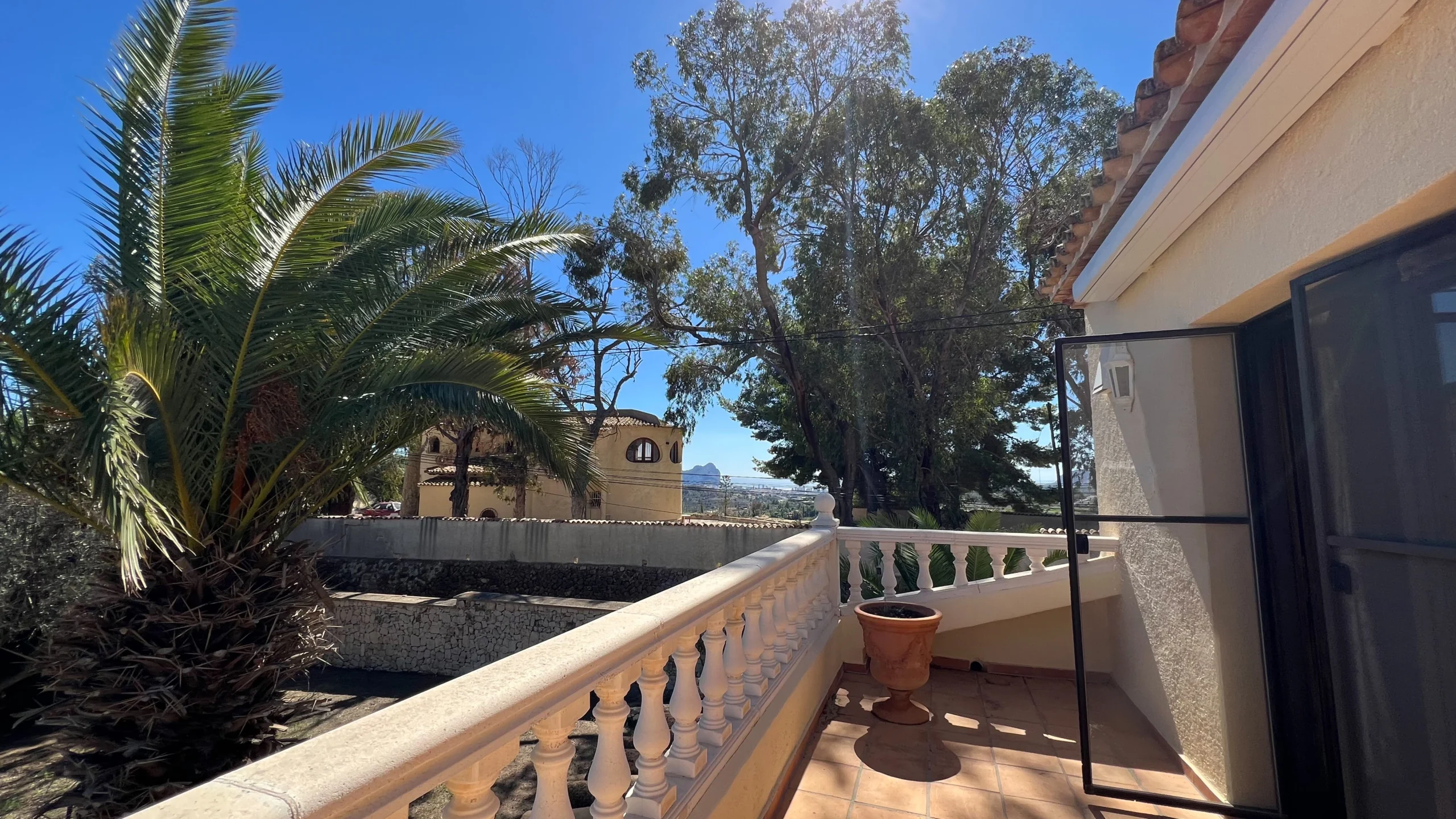 Upper terrace with countryside views and palm trees in Benissa finca