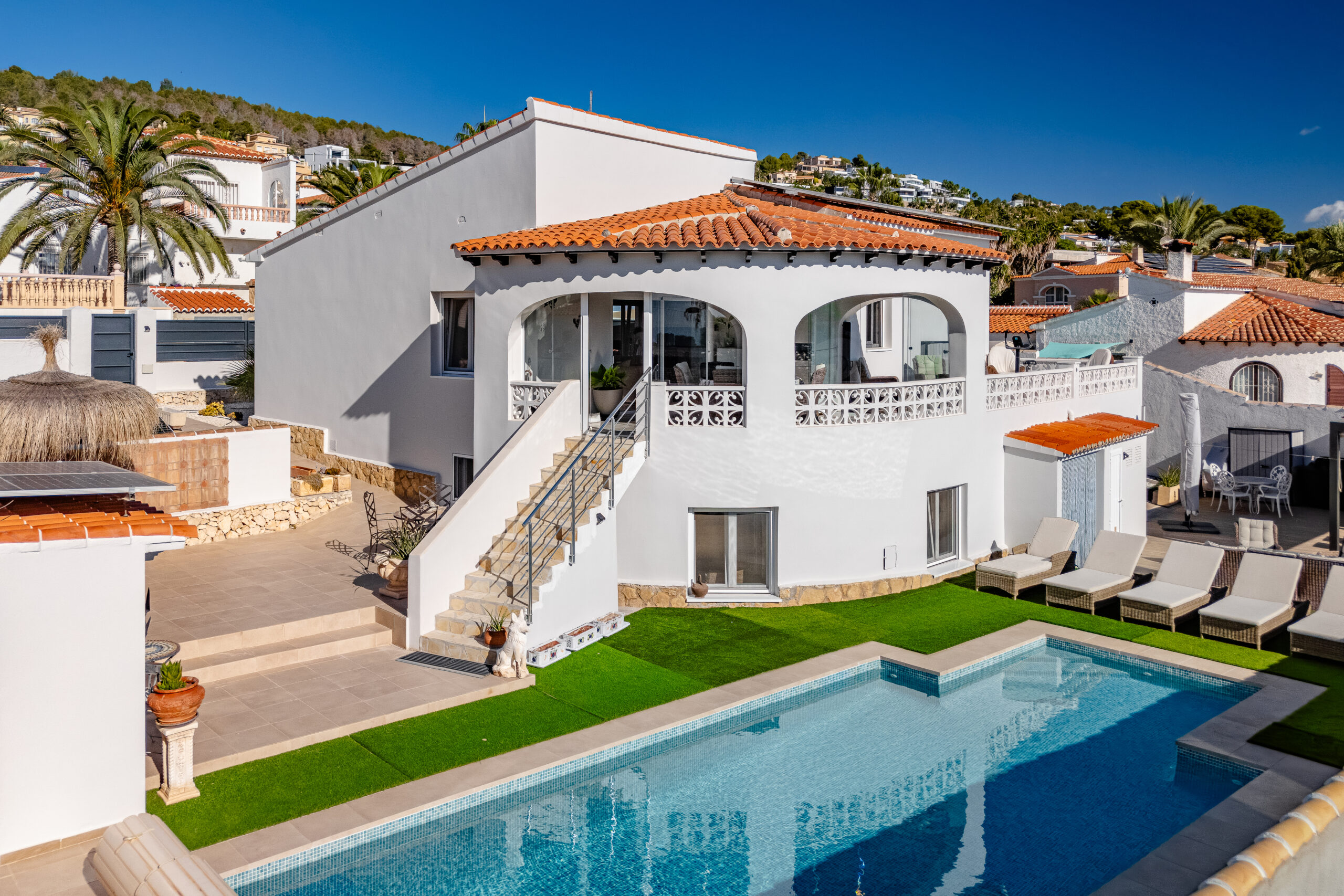 White Mediterranean villa with pool terrace and palm trees in Calpe