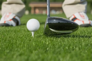 Golf ball and driver on green grass at golf course near Calpe on the Costa Blanca