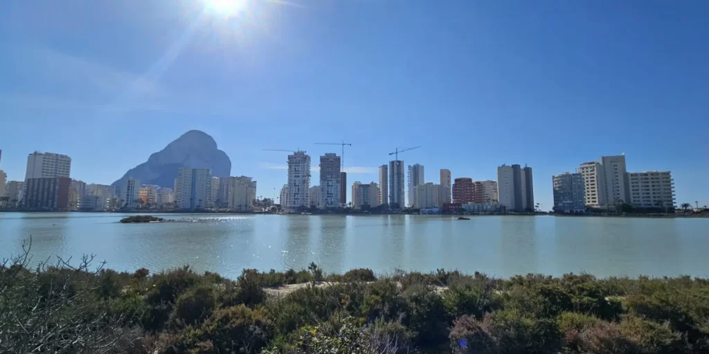 Las Salinas de Calpe with Peñón de Ifach and Calpe skyline reflected in the salt lake, Spain