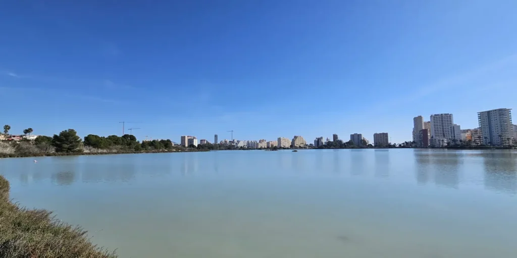 Las Salinas de Calpe salt lake with skyline views and flamingos in Calpe, Spain