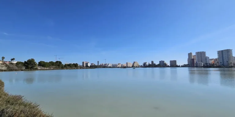 Las Salinas de Calpe salt lake with skyline views and flamingos in Calpe, Spain