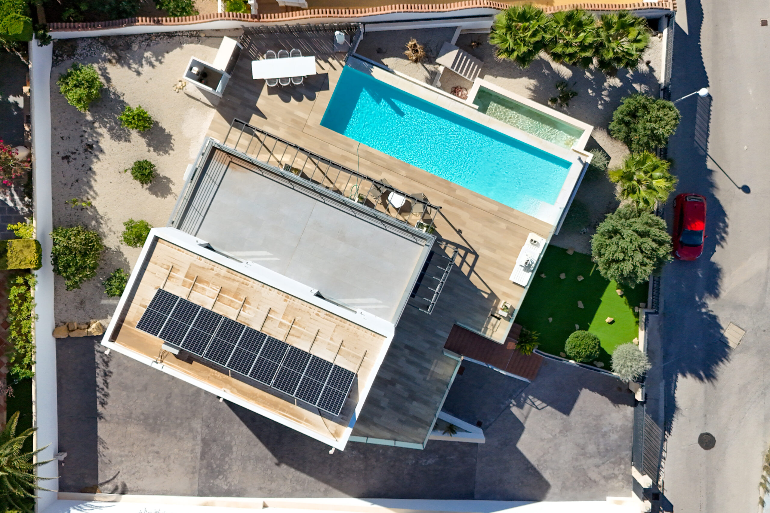 Aerial view of modern villa with pool and solar panels in Casanova, Calpe