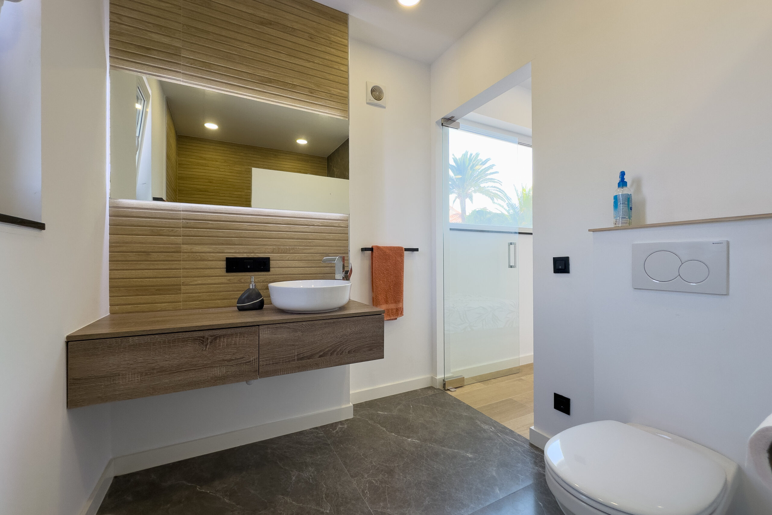 Bathroom with basin, WC and mirror in a modern Casanova, Calpe villa