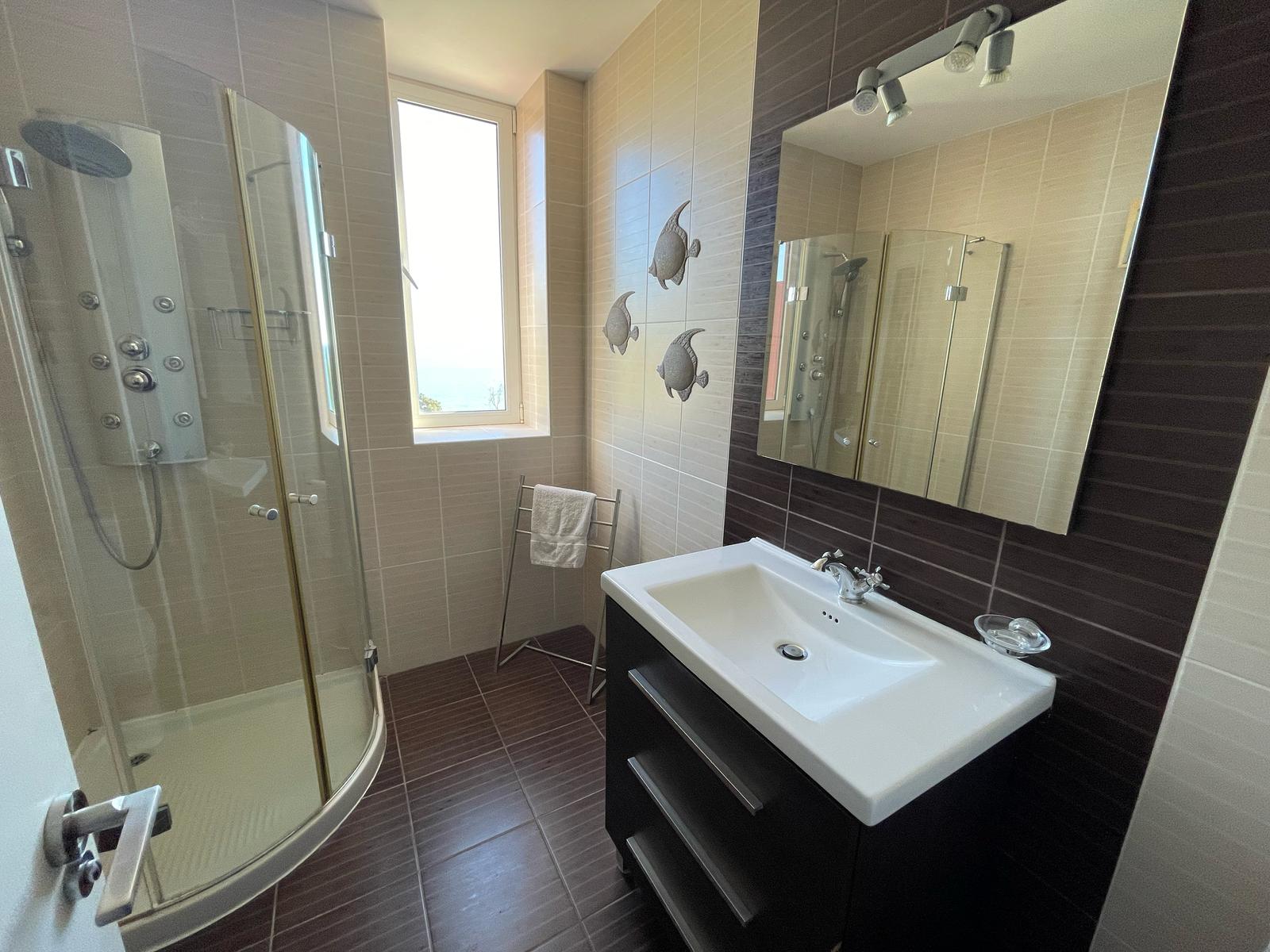Bathroom with shower and vanity in La Muralla Roja apartment, Calpe