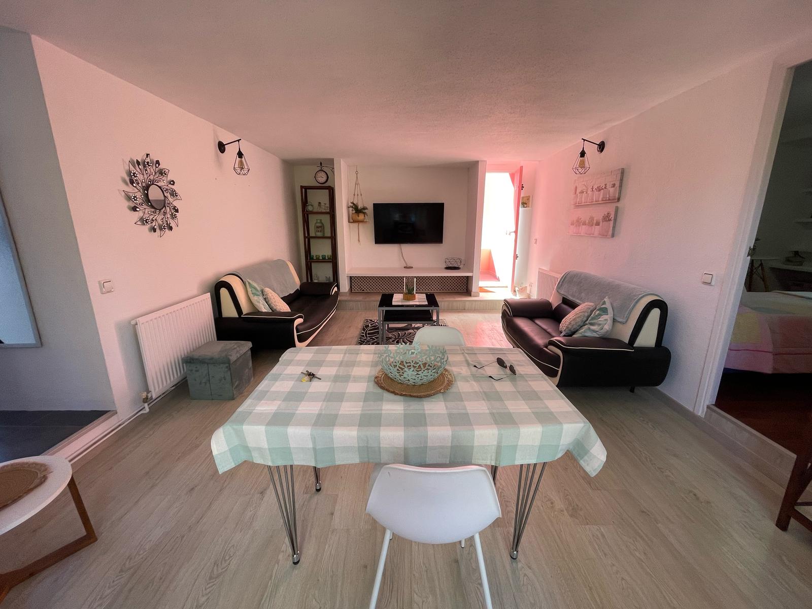 Dining area within the open plan living space in La Muralla Roja, Calpe