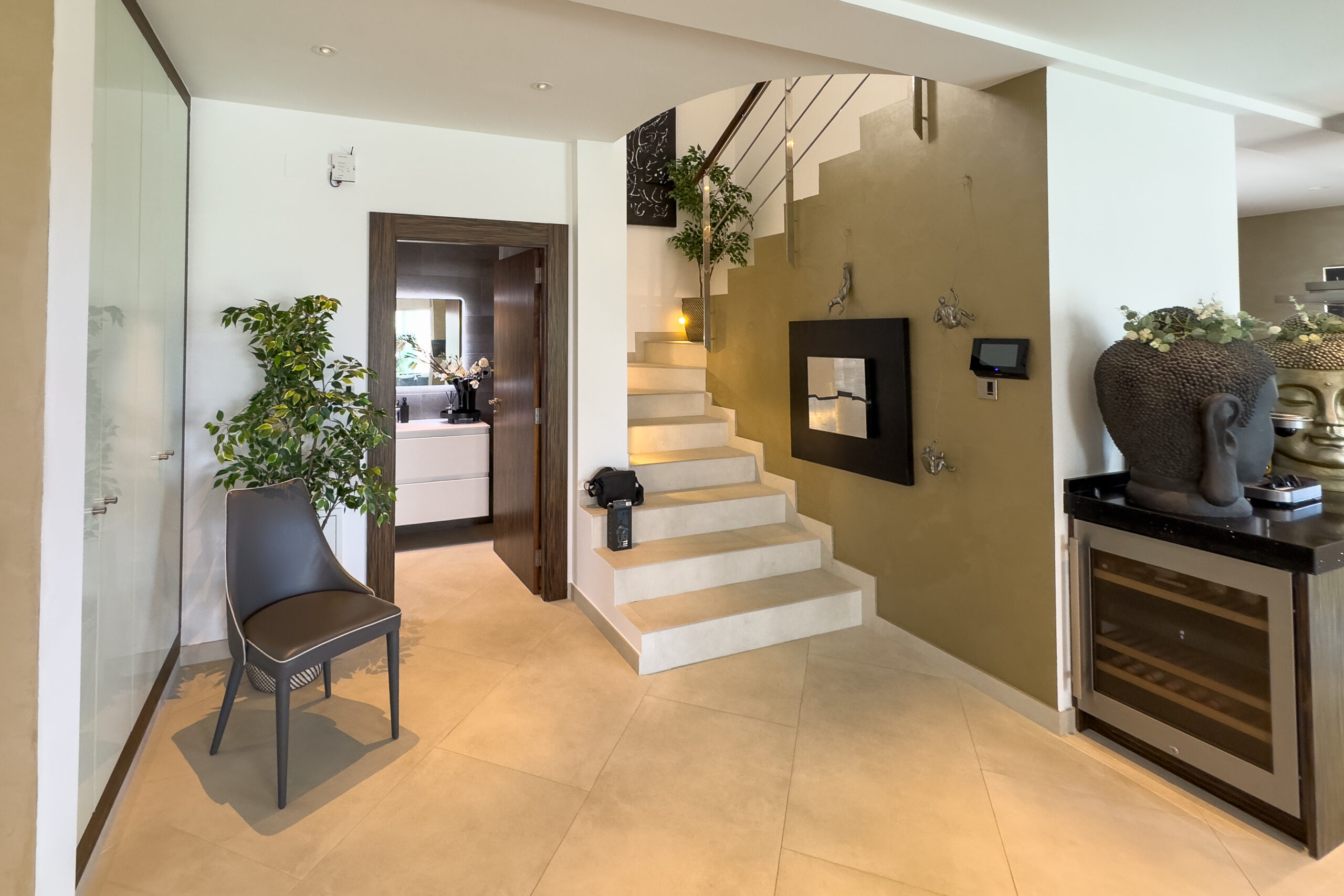 Entrance hall with staircase inside a villa in Moraira