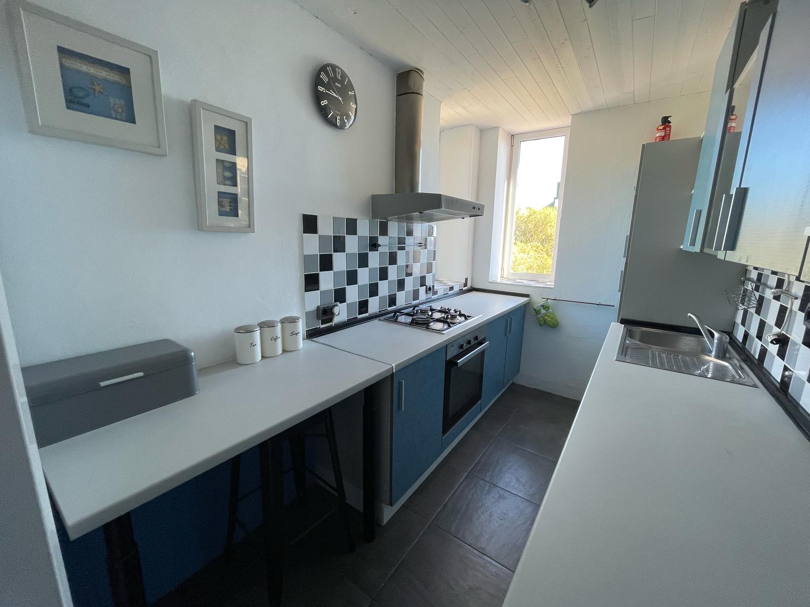 Fully equipped kitchen inside a La Muralla Roja apartment in Calpe