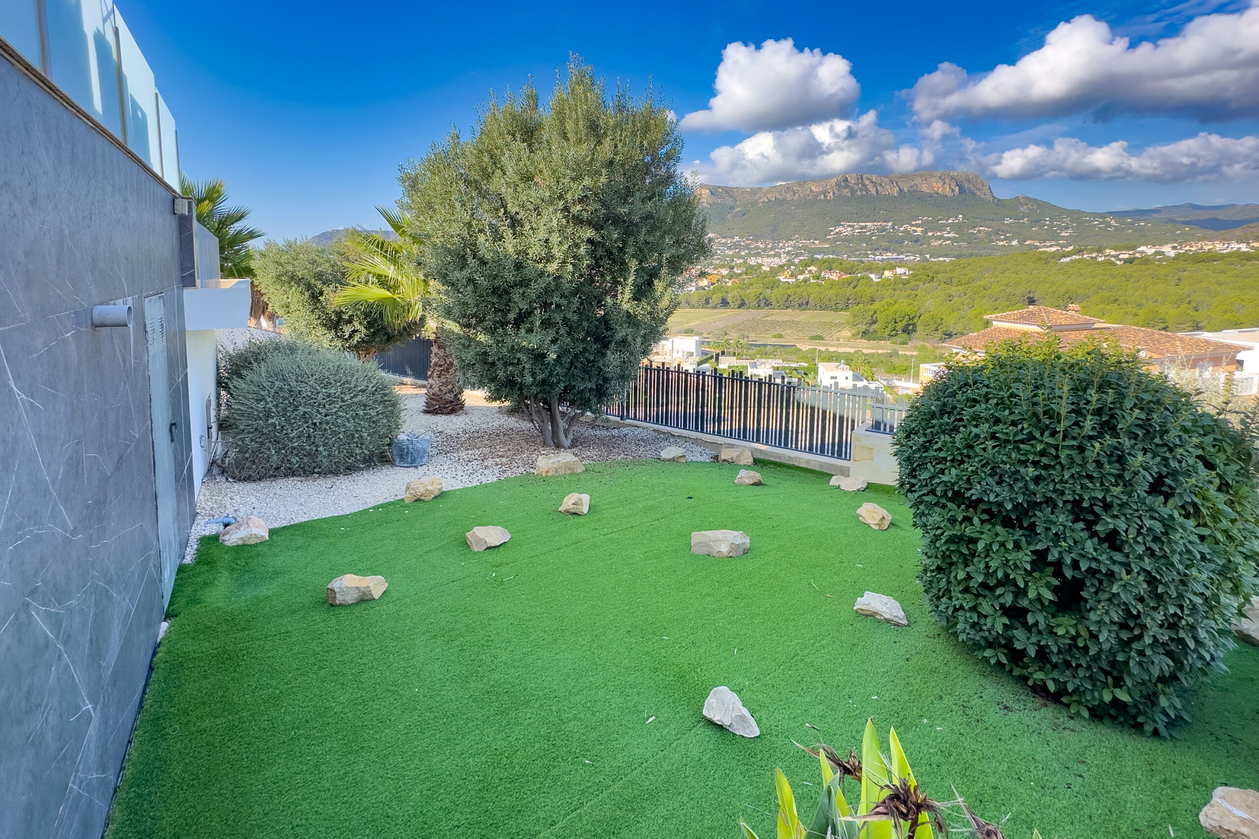 Garden lawn area with open views at a villa in Casanova, Calpe