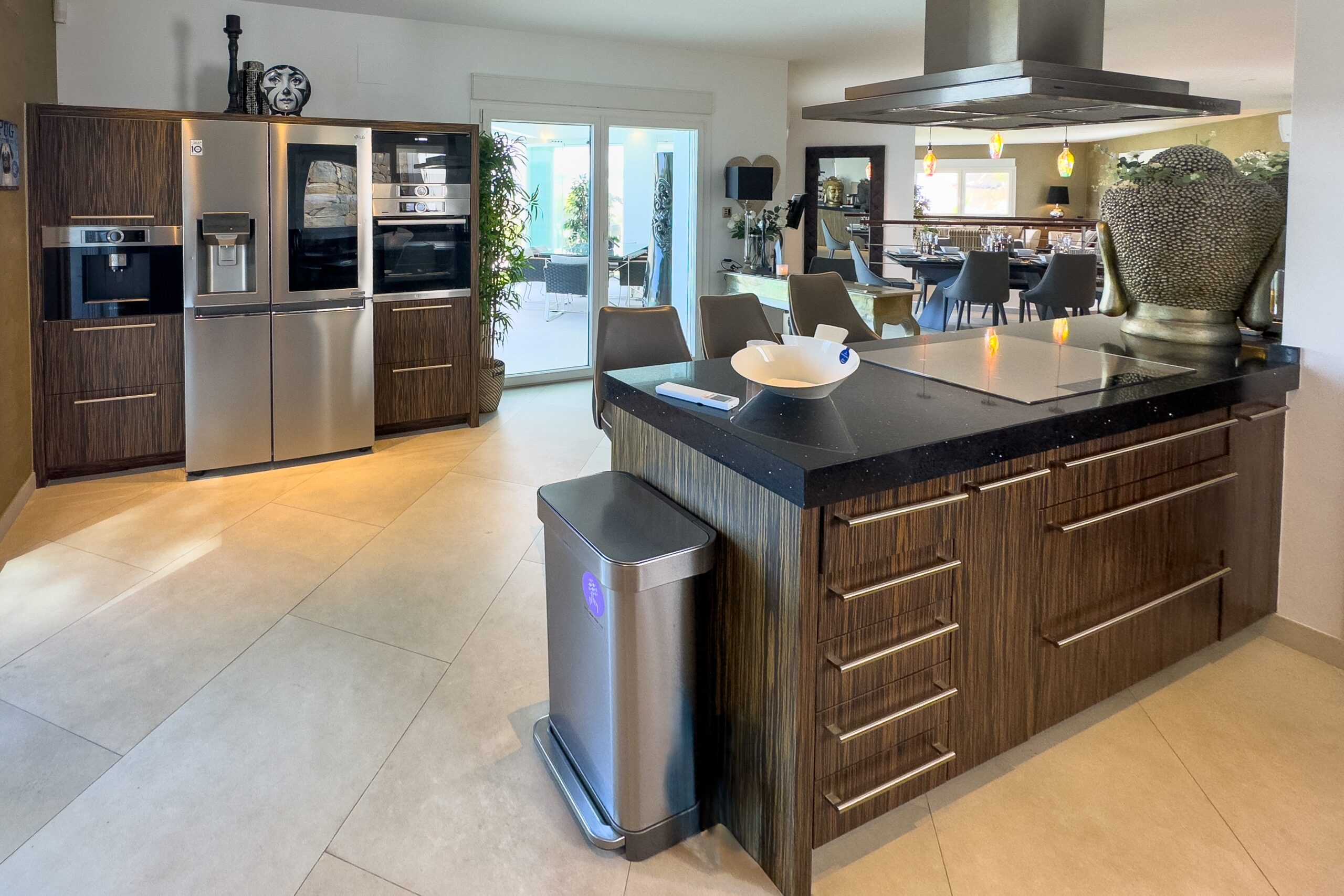 Modern kitchen with central island and built-in appliances in Moraira villa