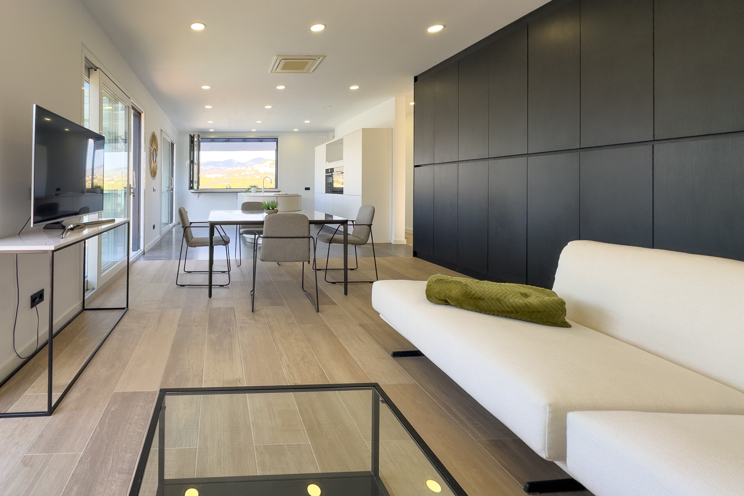 Open plan living room and dining space in a modern Calpe villa