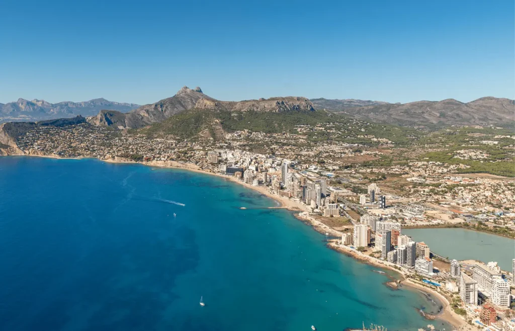 Aerial view of Arenal-Bol in Calpe showing the beachfront, apartment buildings, and bay
