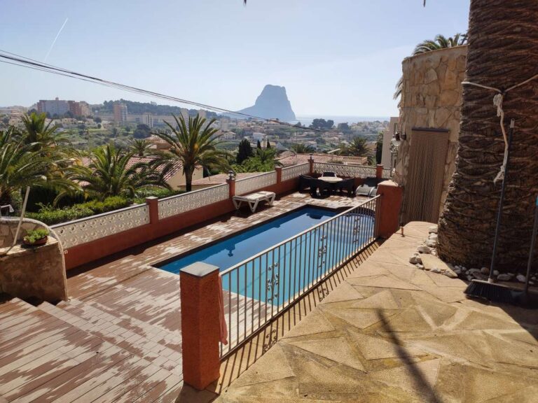 Pool terrace with views towards the Peñón de Ifach at a refurbished villa with three independent apartments in Canuta, Calpe.