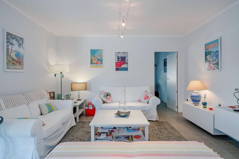 Second living room inside a modern villa in Calpe with sofa seating, TV unit and bright interior space