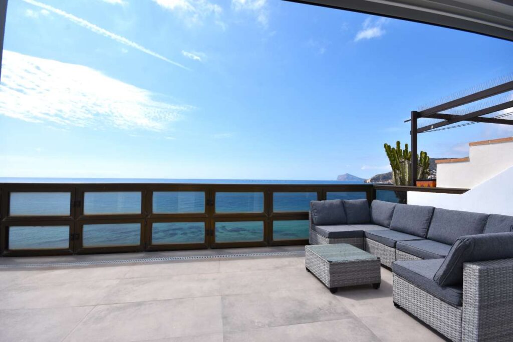Private terrace with outdoor seating and sea views at a frontline double penthouse on Arenal Beach in Calpe.