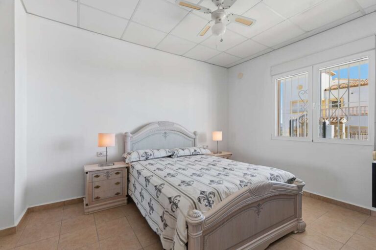 Double bedroom with natural light inside a villa in Calpe.