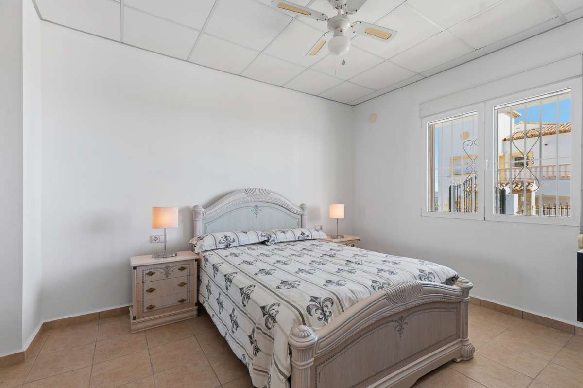 Double bedroom with natural light inside a villa in Calpe.